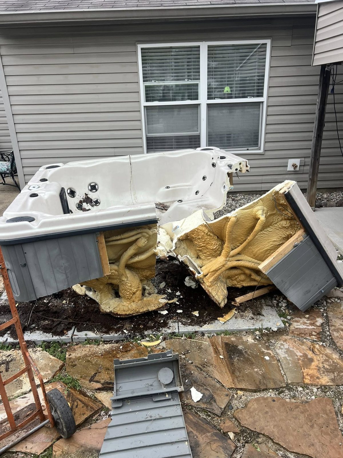 Q&Q Property Solutions crew removing a demolished hot tub in Indianapolis