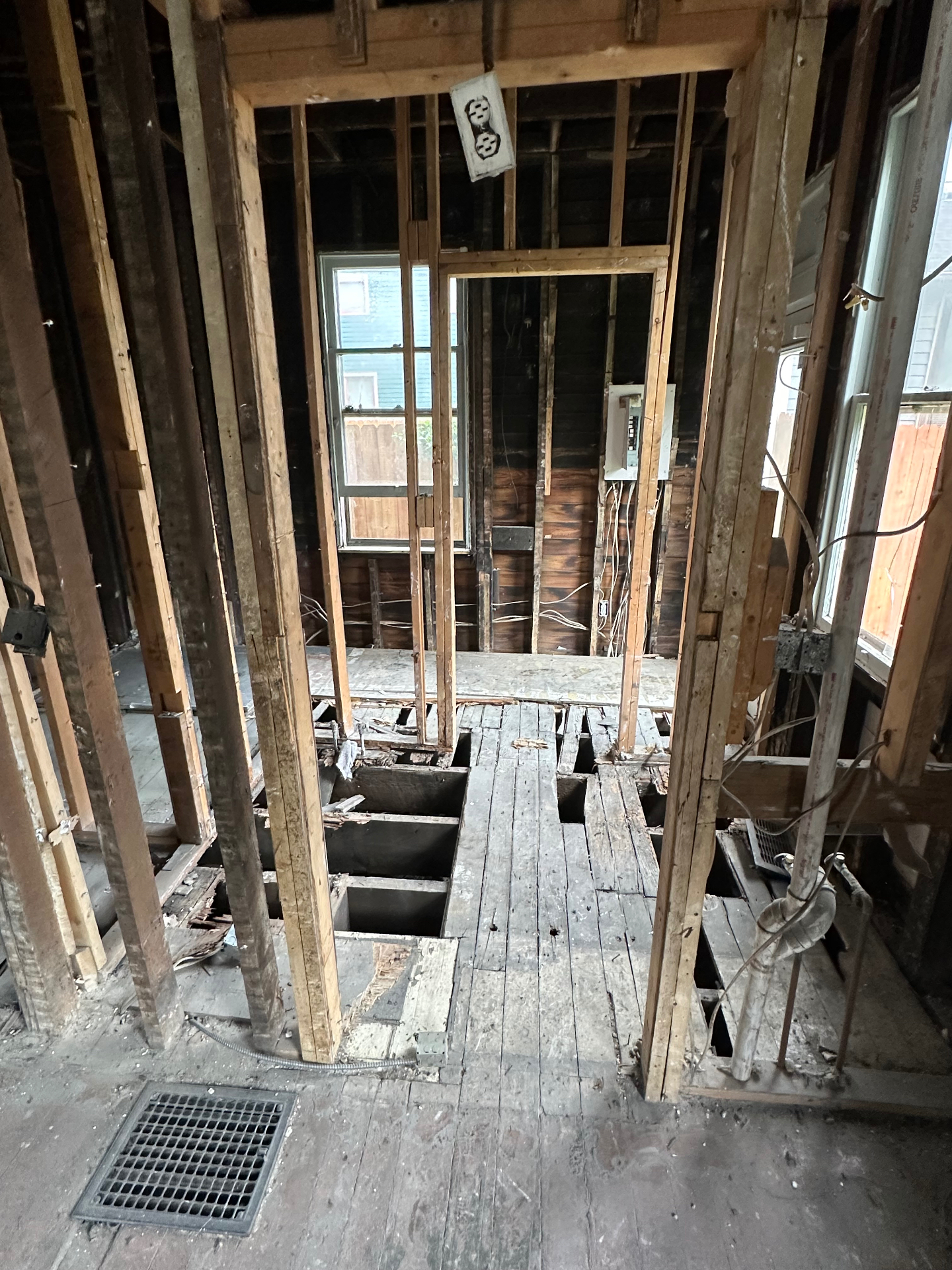 Bathroom demoed down to framing and floor joists